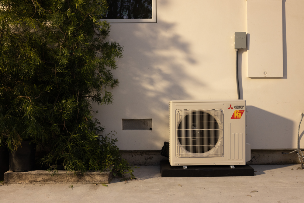 Mitsubishi Electric ducted system outdoor unit against a house exterior